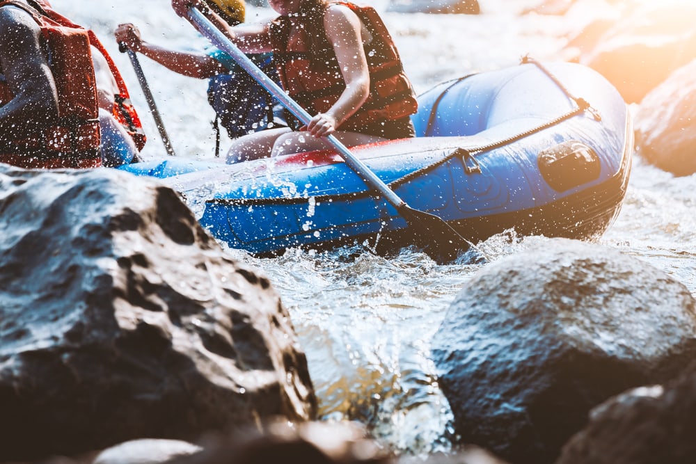 close up of rafters rafting on a river