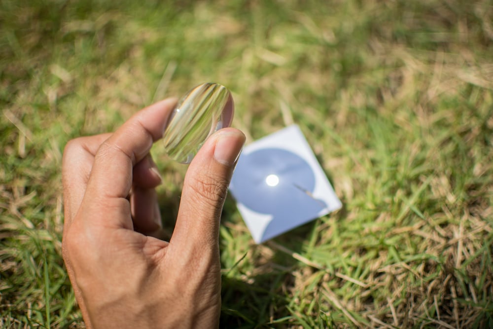Solar Mirror Lighter lighting up the paper