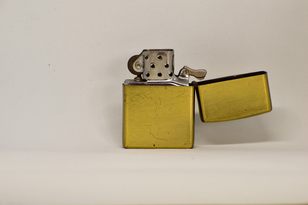 Zippo style lighter standing on white background