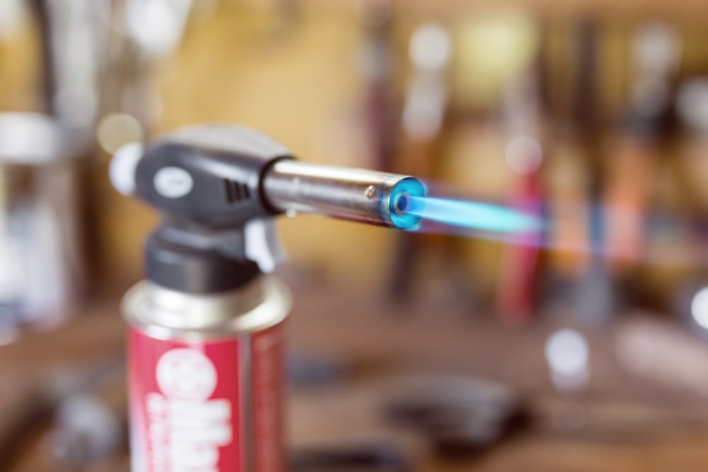 Close up photo of the fire in a torch/jet lighter 
