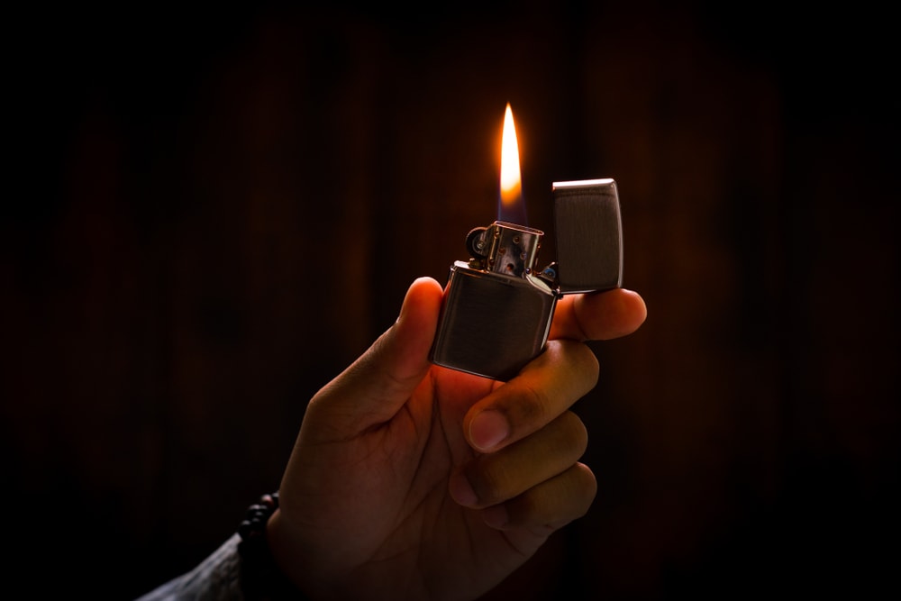 Zippo Lighter lit in the dark