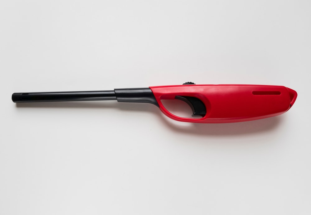 Utility Lighter laying on a white table
