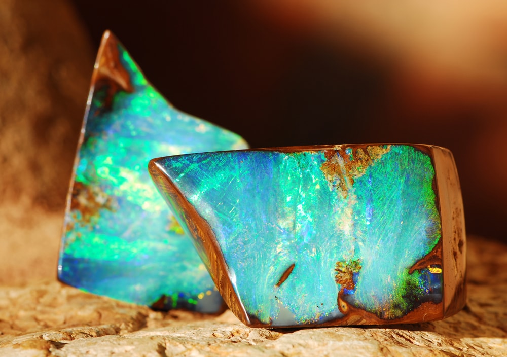 Australian boulder opal laying on a rock