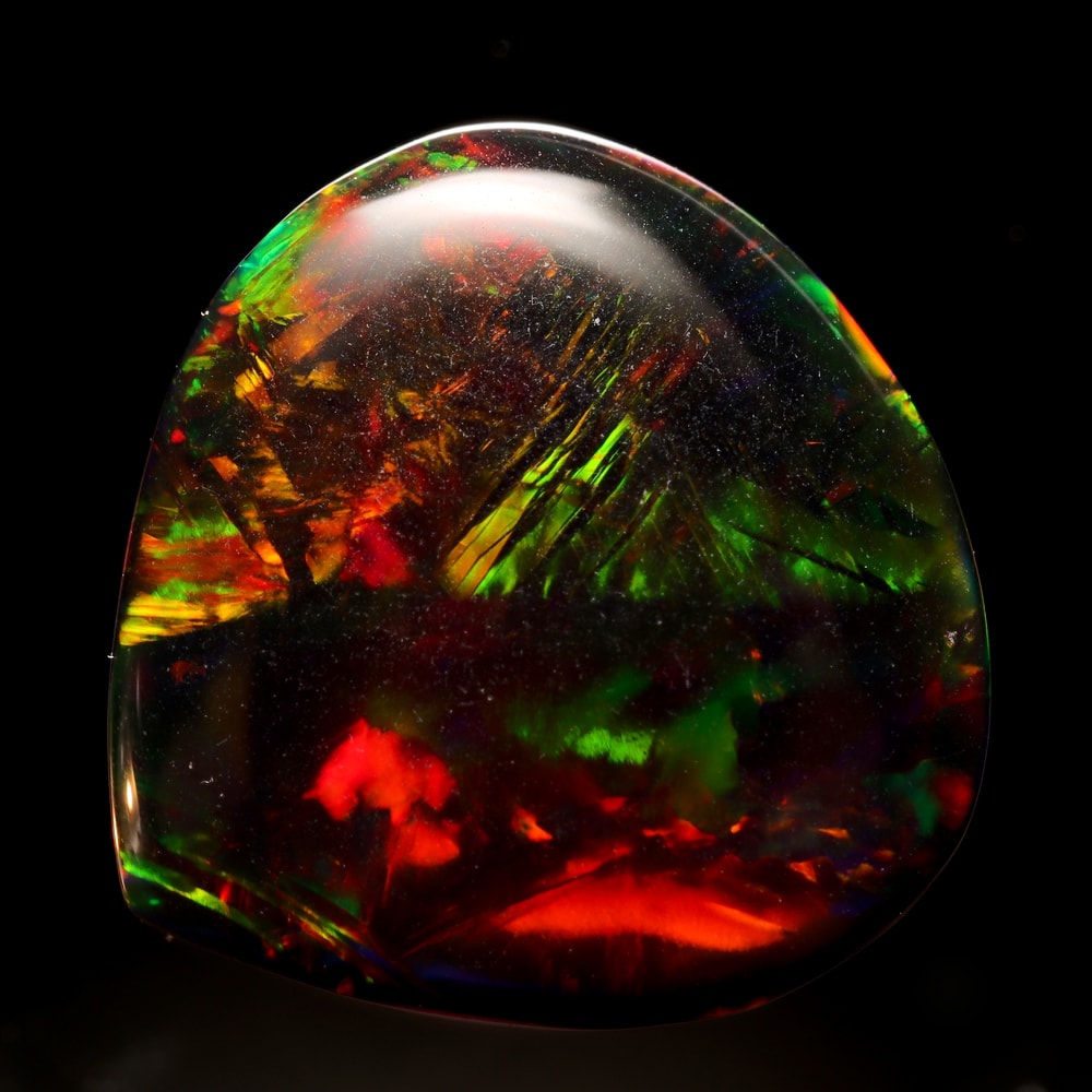Portrait of a black opal in black background