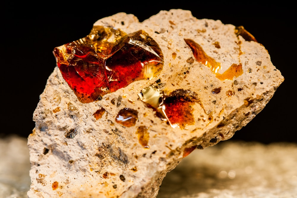 Fire opals on a brown rock