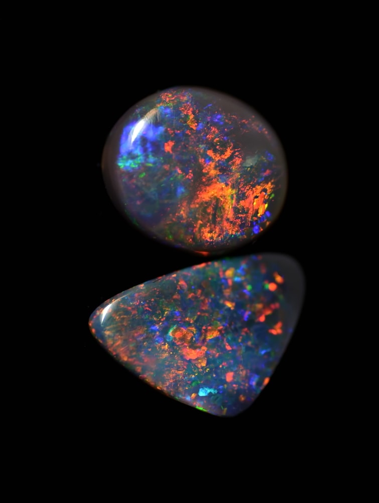 Australian Black Fire Opals on black background