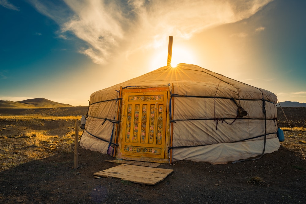 sunset over a ger yurt accomadation