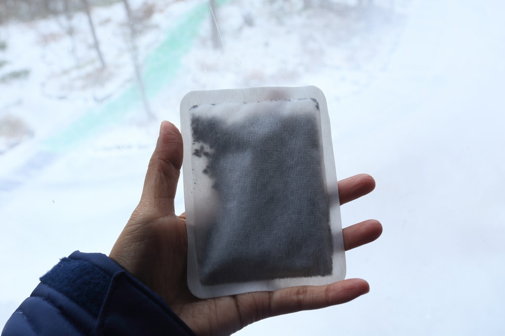 a hand holding a hand warmer 