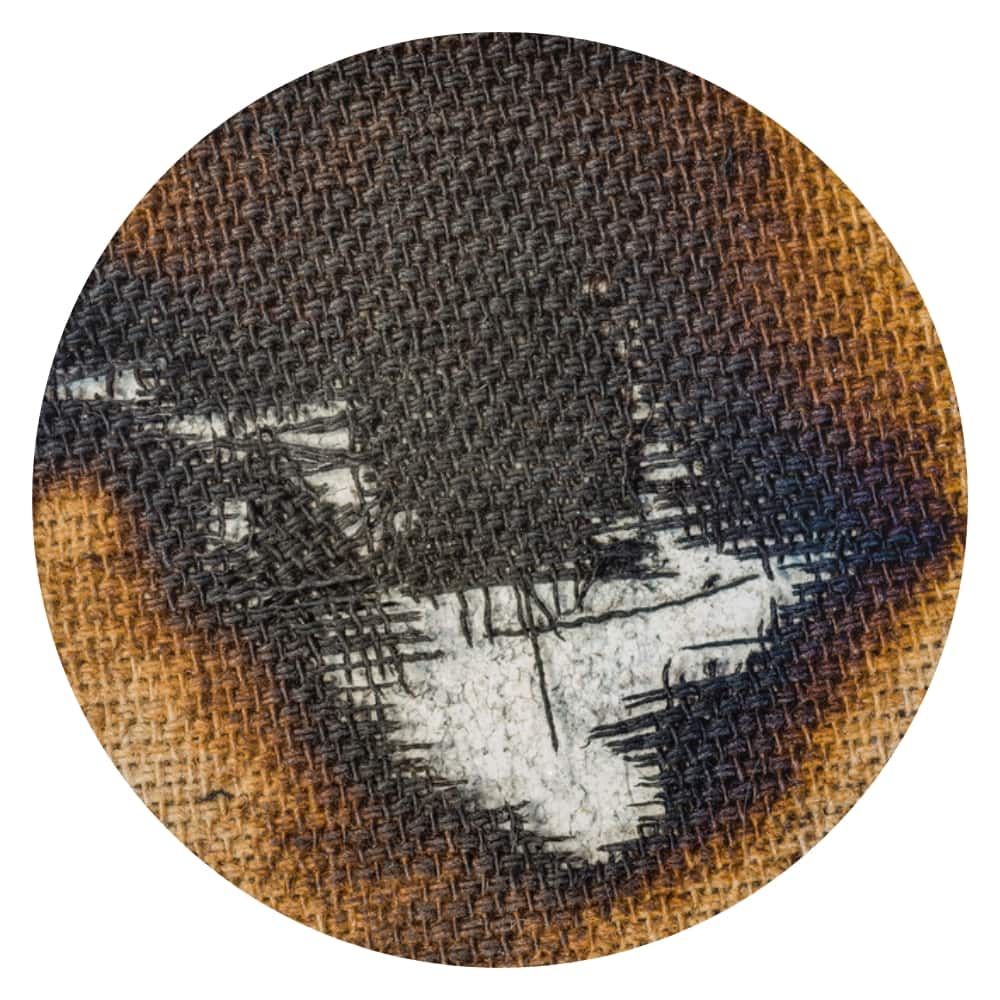 a burned piece of canvas