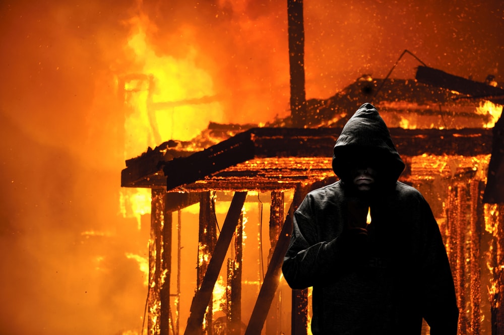 burning house and an arsonist