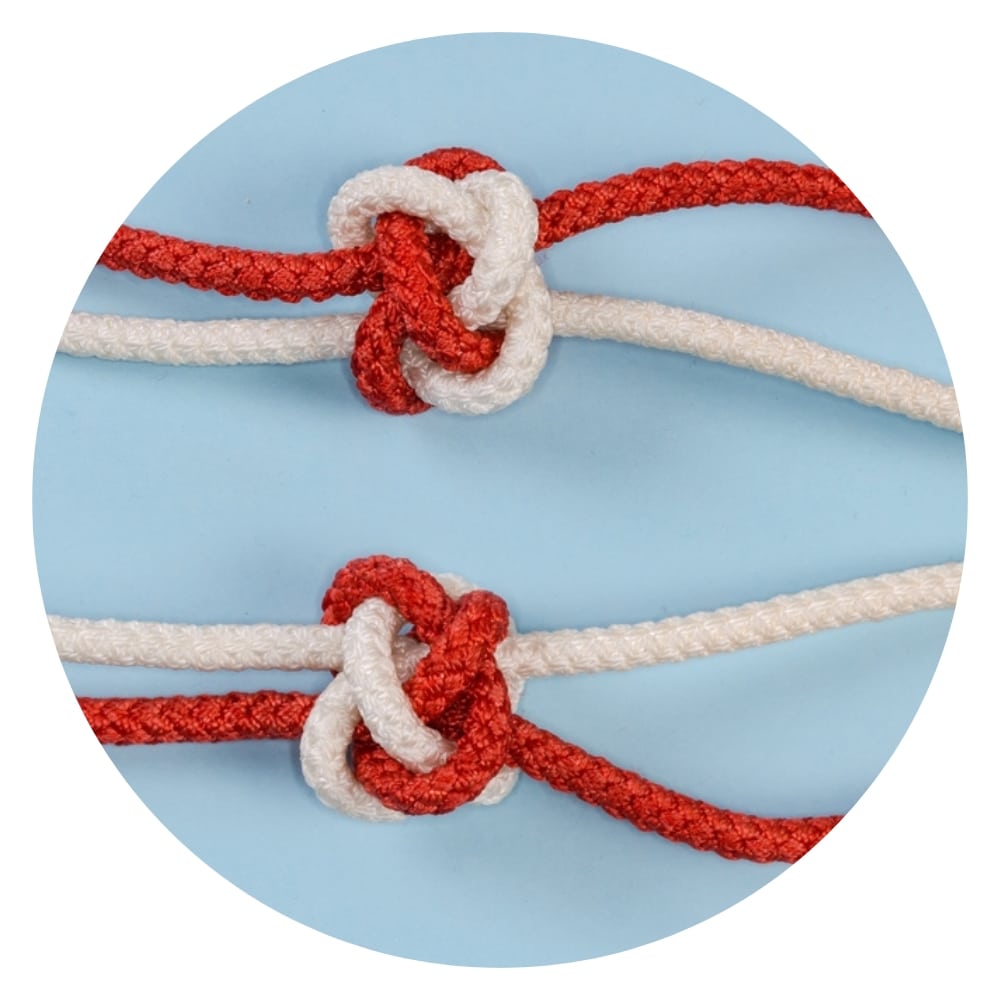 red and white thread in a diamond knot
