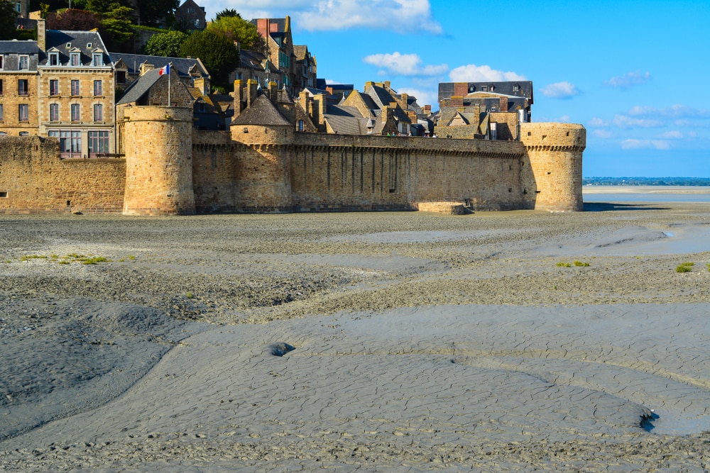 Quicksands near the walls of abbey Mont Saint-Michel, Normandy, France.