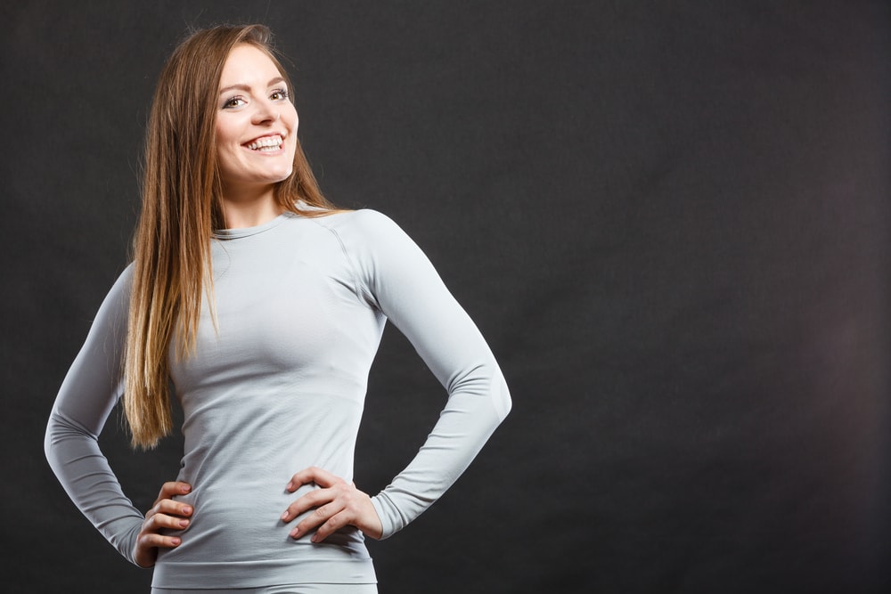 A woman wearing a gray thermal base underwear